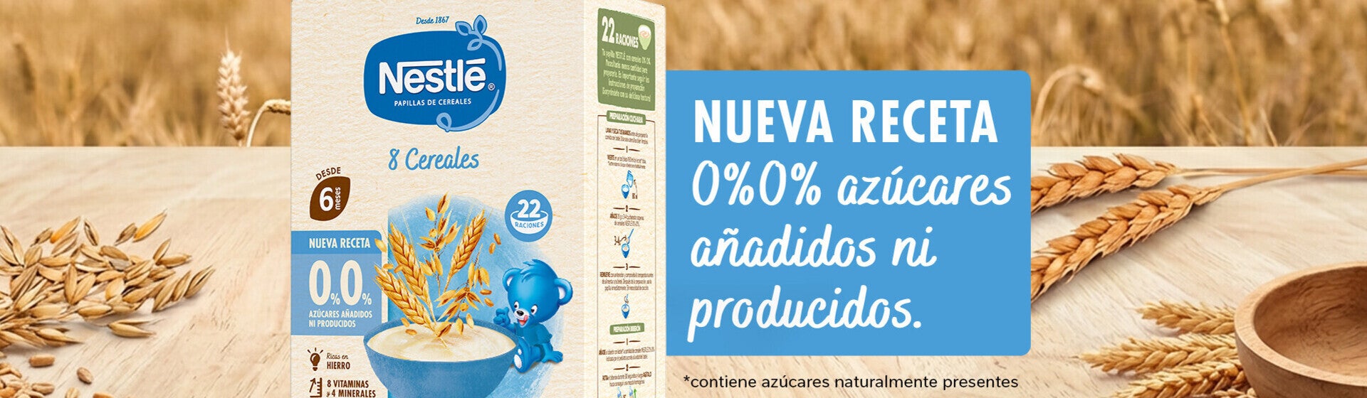 Nestlé cereal box on a wooden table with wheat field in background.